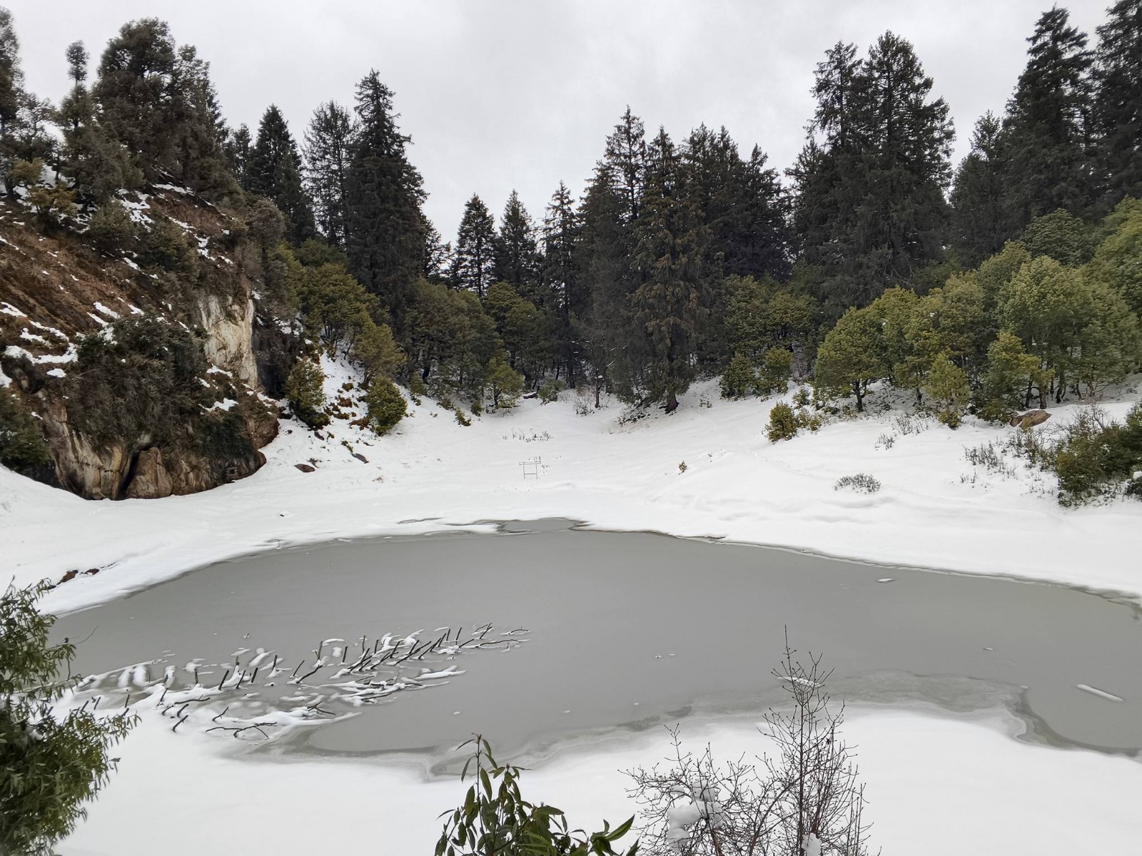 Frozen high-altitude pond in Saal Valley winter, Chamba Himalayas