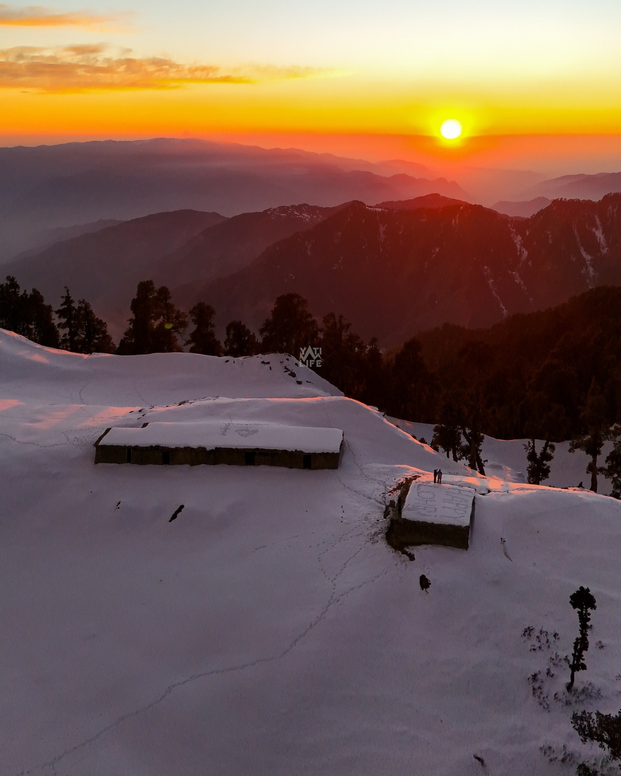 Snow-clad shepherd hut at sunset above Saal Valley with Dhauladhar layers