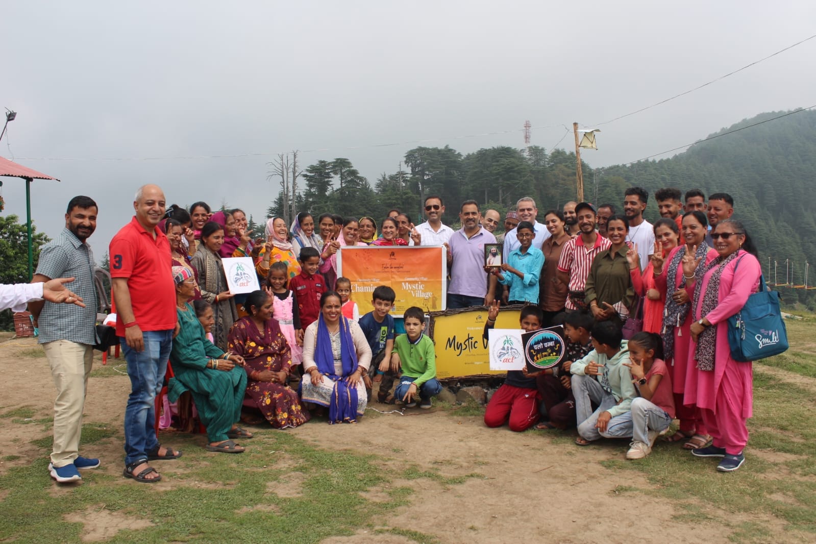 Community gathering of villagers and visitors at a Mystic Village celebration on a deodar ridge in the Khajjiar cluster, Chamba