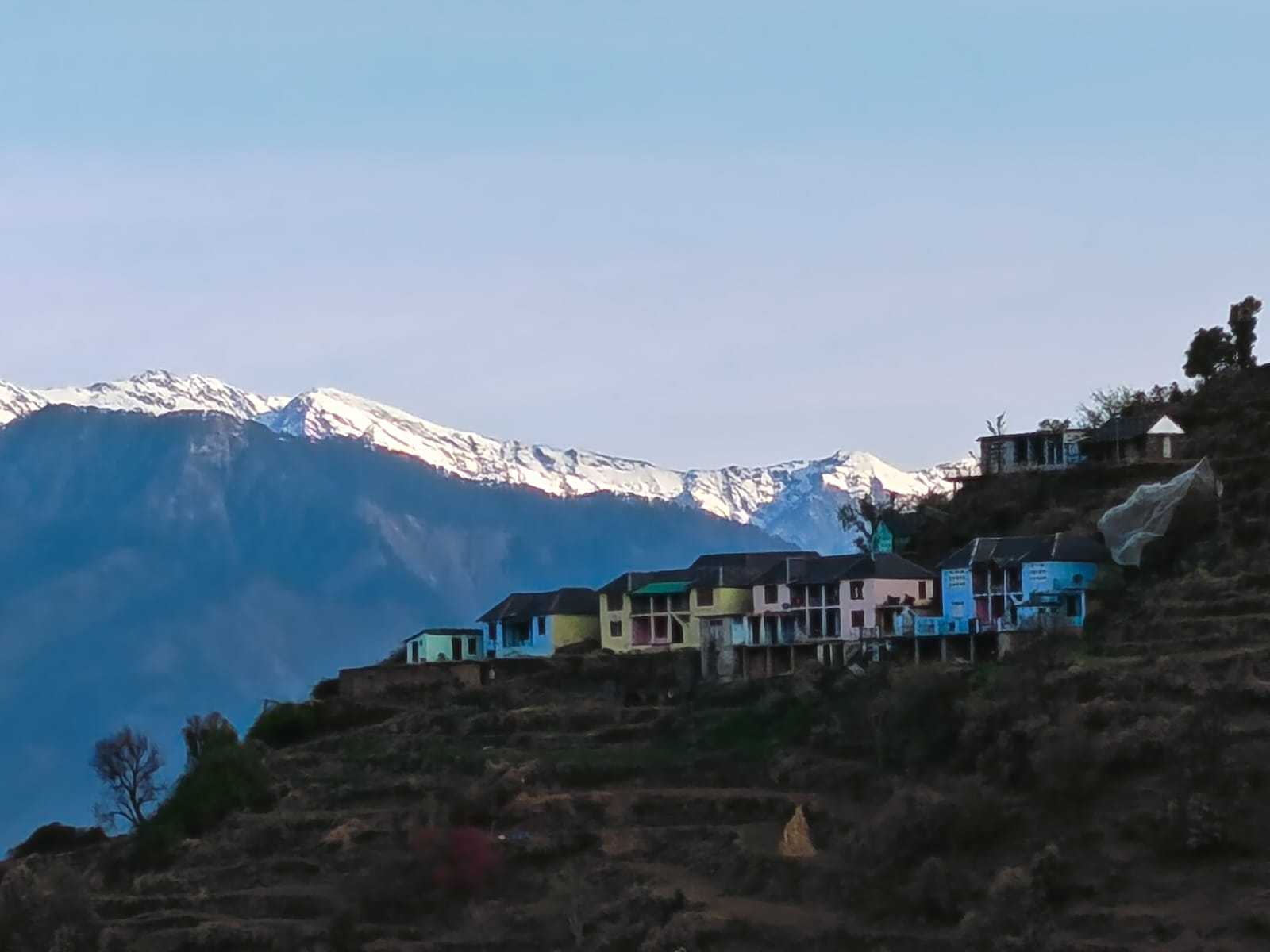 Hilltop hamlet with snow-clad peaks at first light — Dwat Mahadev dawn, Chamba