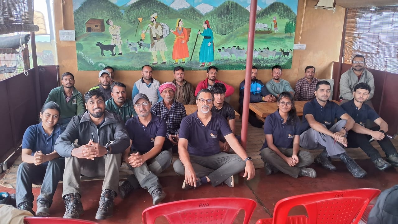 Mystic Villages community hosts and Chalo Chamba team gathered under a Gaddi shepherd mural at a Khajjiar homestay, Chamba