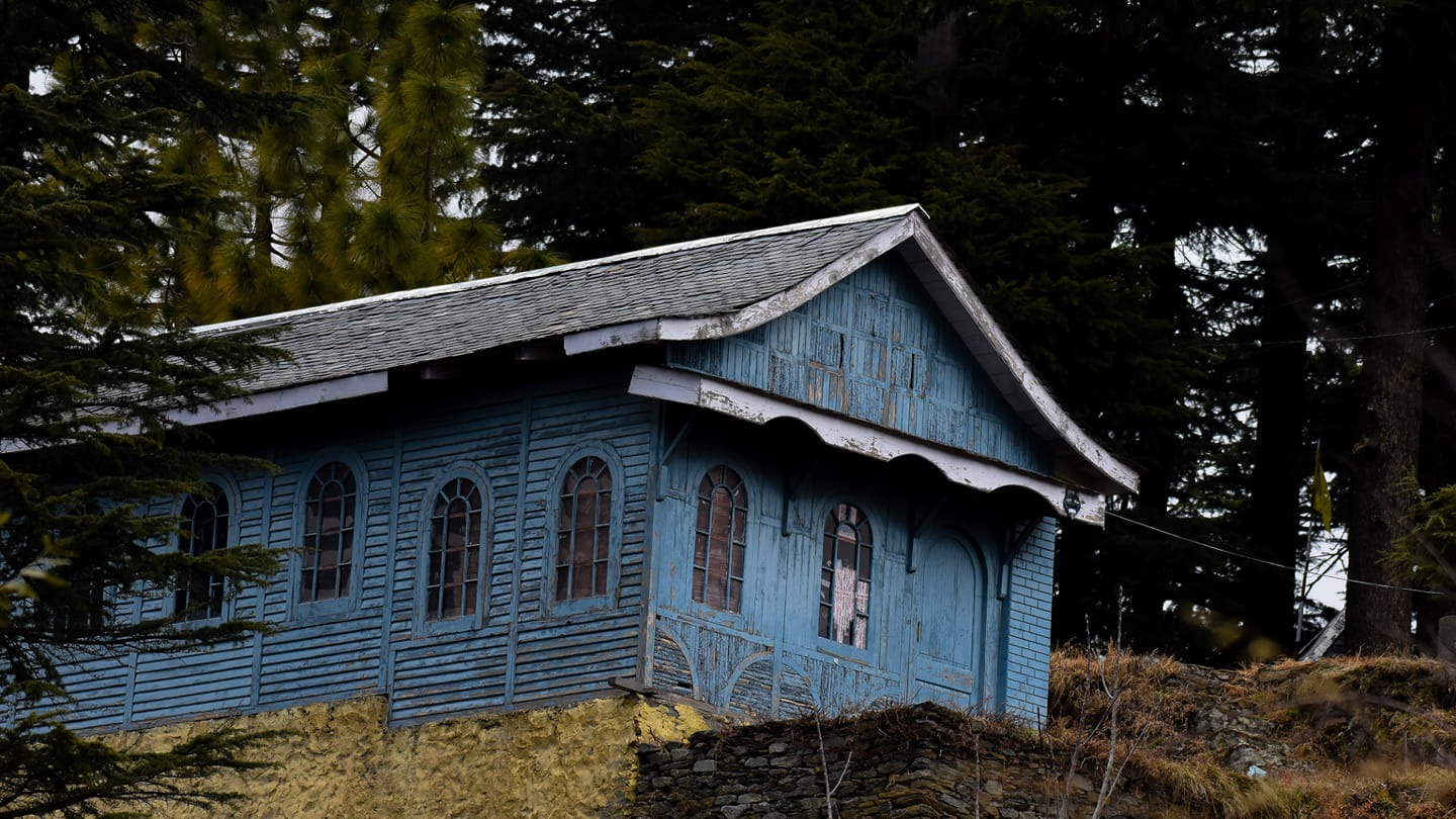 Heritage blue wooden Kathkuni cottage in the pines of Saal Valley, Chamba