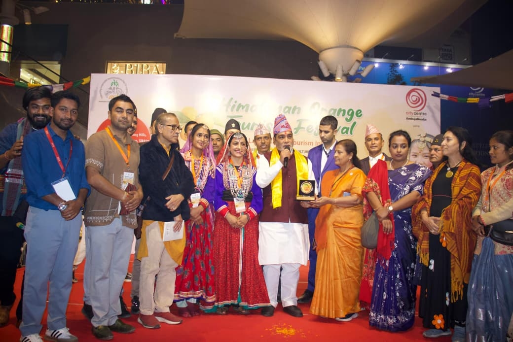 Chalo Chamba team receiving the Himalayan Orange Tourism Festival recognition for Mystic Villages of Khajjiar, Chamba