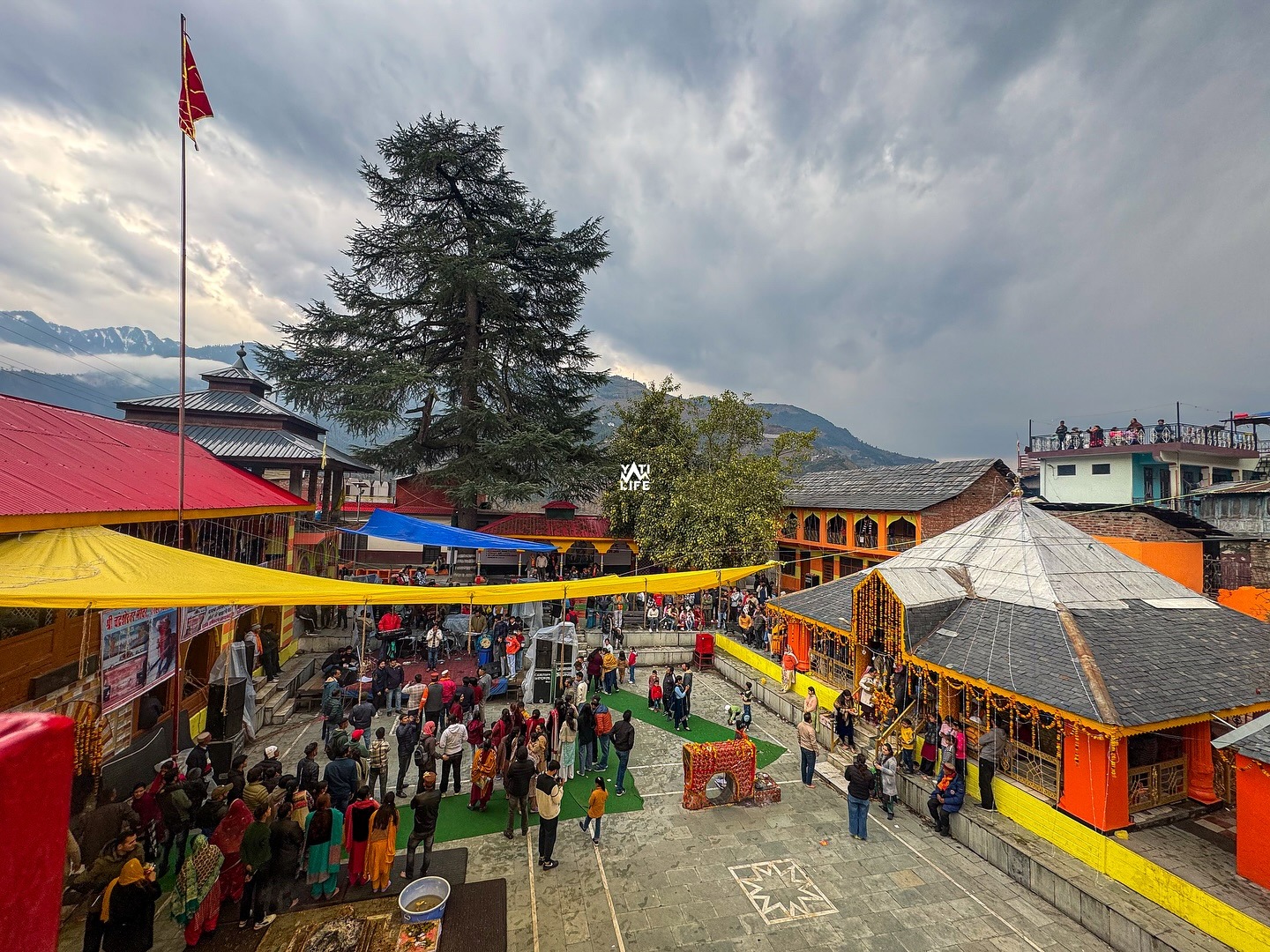 Village festival gathering at the Saal Valley temple courtyard, Chamba