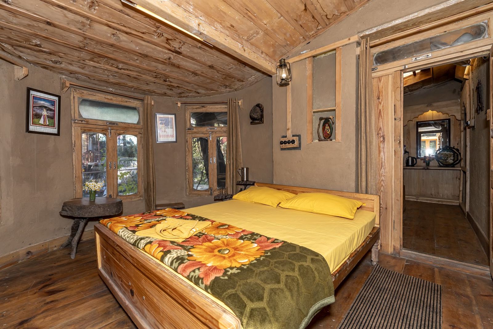 Attached bathroom with copper fixtures inside a twin room at Parbatwaas Retreat, Chamba